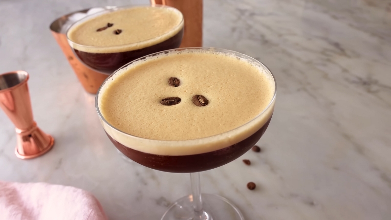 Creamy Espresso Martini served in a coupe glass with coffee beans on top